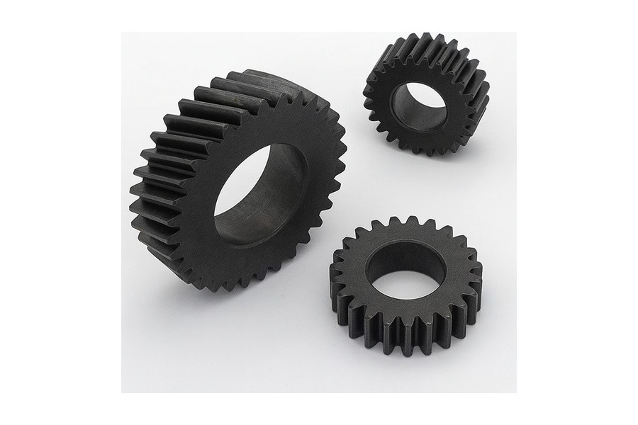 Three toothed gears with central bores illustrating gear delivery stages